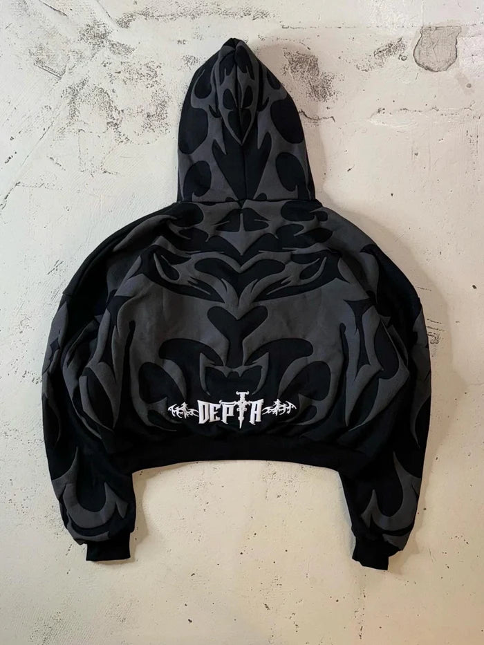 Tribal Shadow Depta Hoodie by Thread Shade – Unisex oversized hoodie featuring all-over puff print, hidden side pockets, and a relaxed fit. Made with 400gsm cotton fleece for ultimate comfort and style.