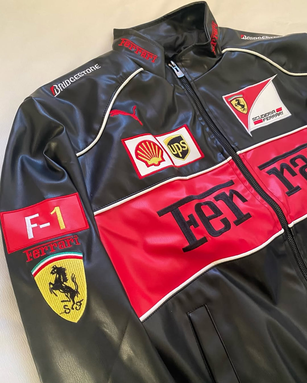 Close-up Ferrari Embroidered Patch and Logos on Leather Jacket