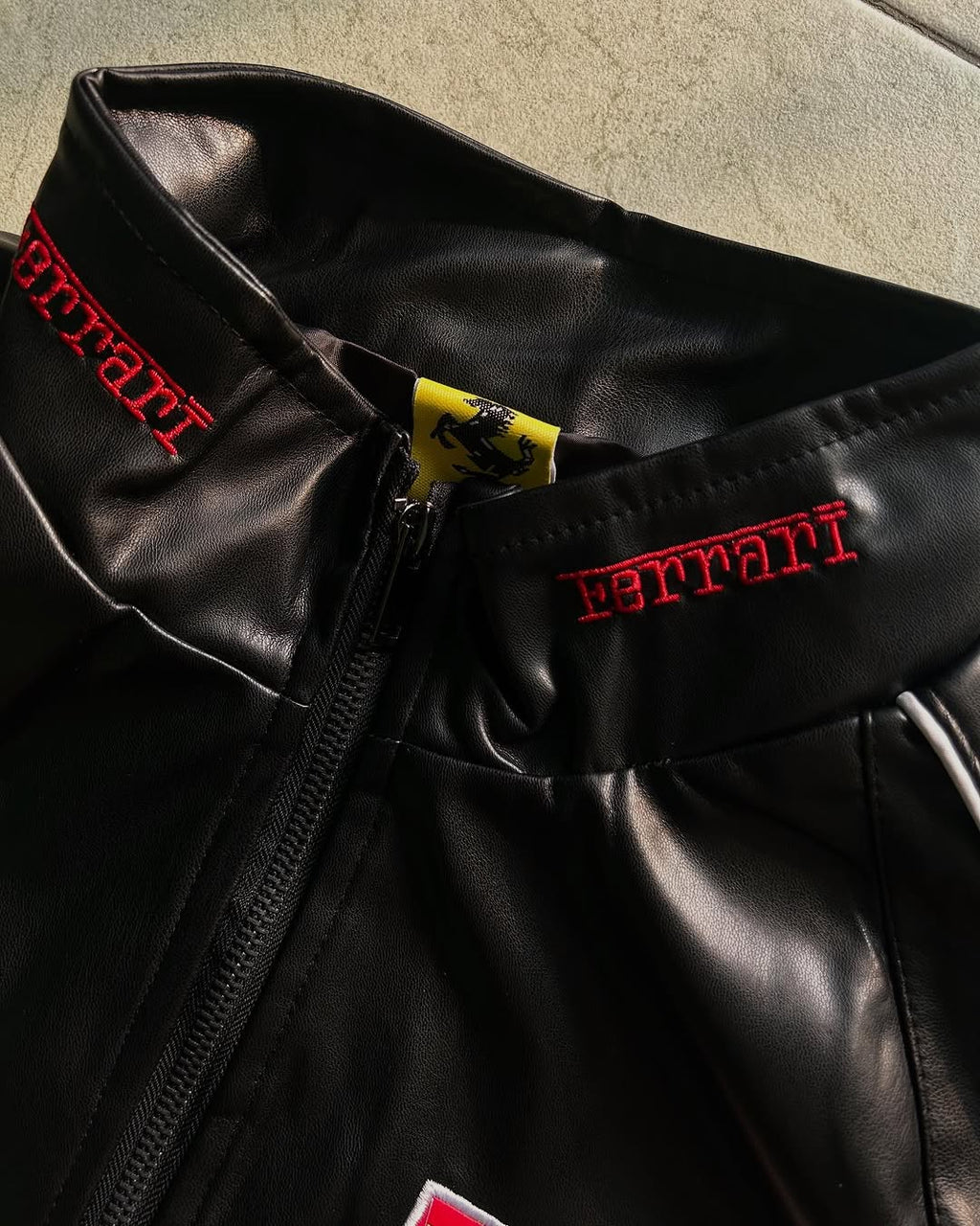 Detailed View of Scuderia Ferrari Shield Patch on Jacket