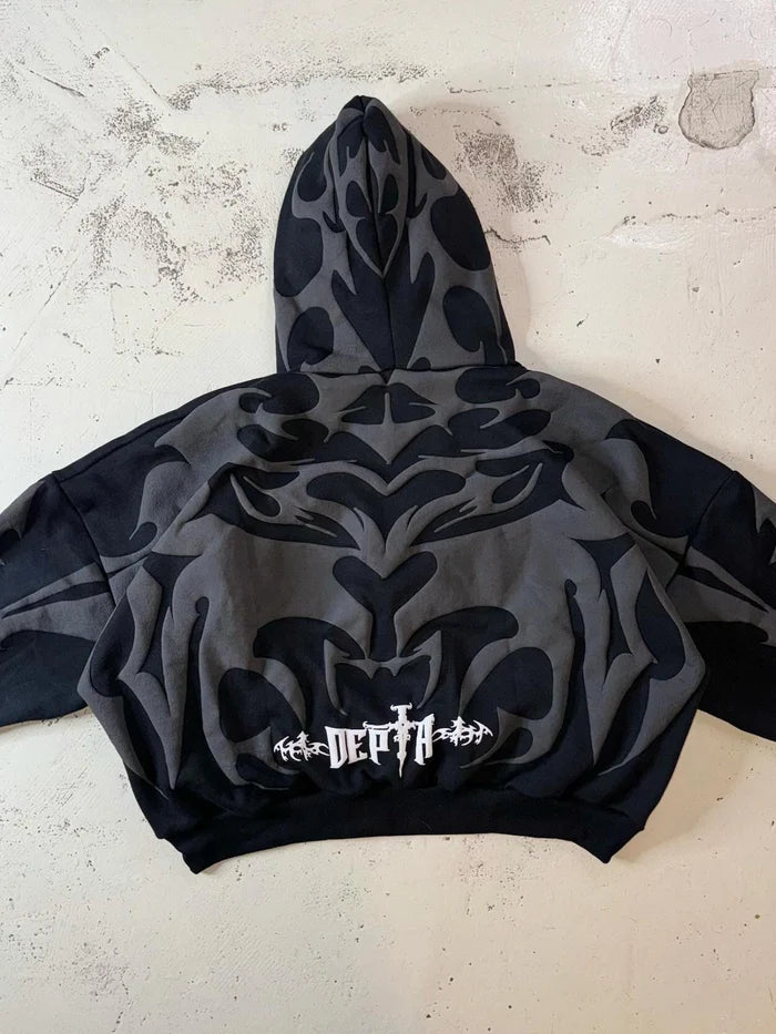 Tribal Shadow Depta Hoodie by Thread Shade – Unisex oversized hoodie featuring all-over puff print, hidden side pockets, and a relaxed fit. Made with 400gsm cotton fleece for ultimate comfort and style.