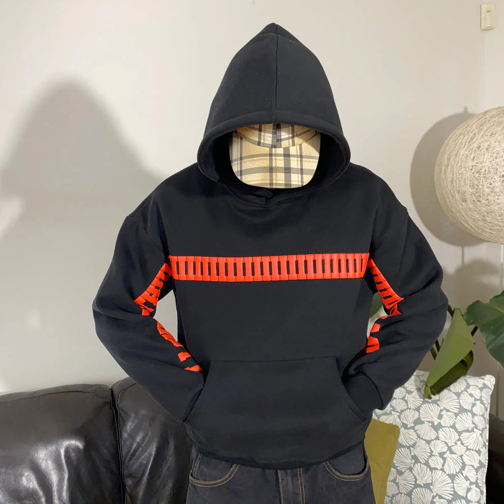 Back view of couple wearing oversized hoodies with matching love design