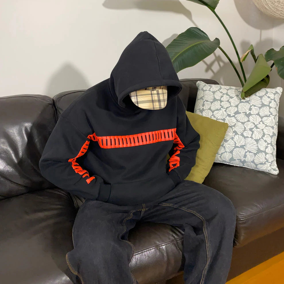 Black oversized hoodie with I LOVE YOU THIS MUCH printed in bold red font