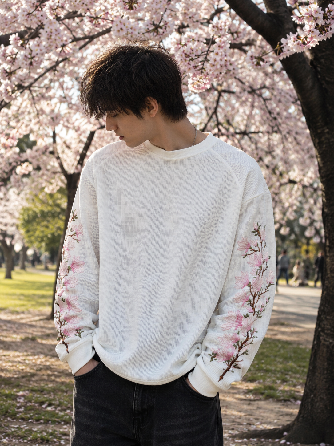 Model wearing Sakura Drift Waffle Tee with oversized Korean streetwear inspired fit and embroidered sleeves.