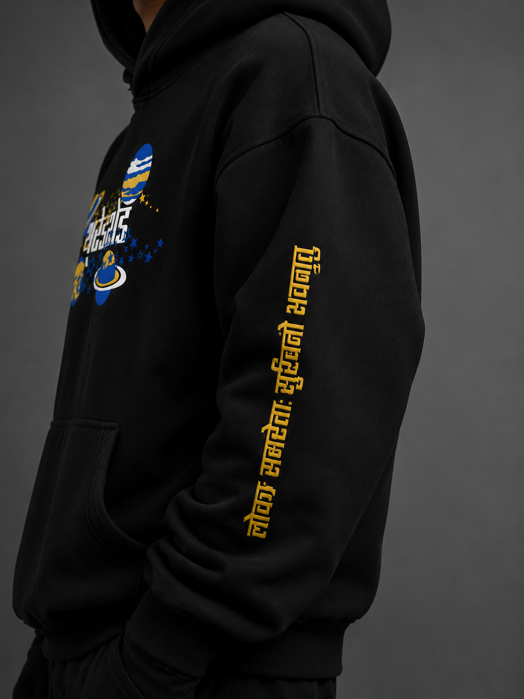 Close-up of Sanskrit sleeve puff print on SHIVA // ORIGIN premium oversized hoodie.